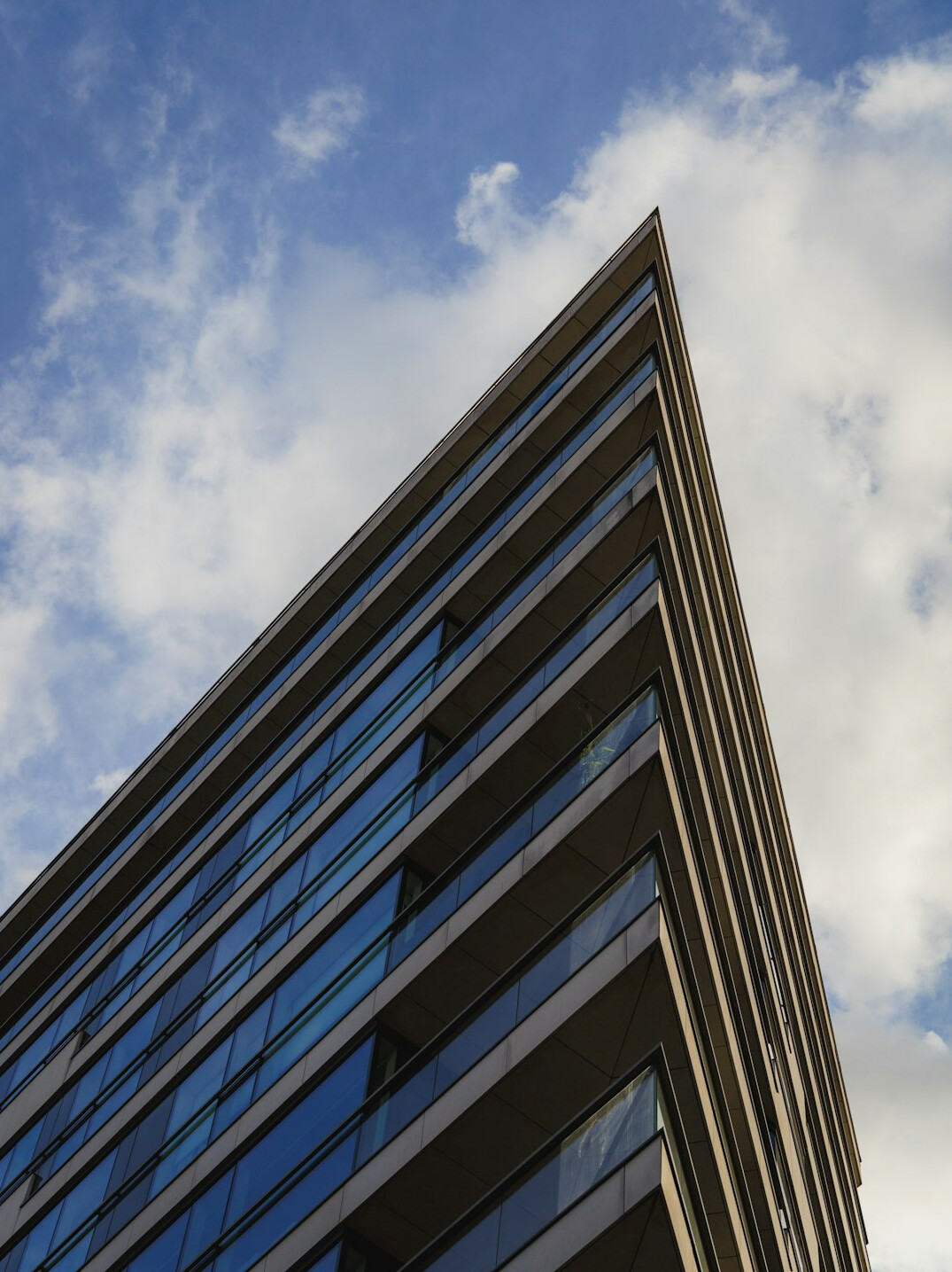 Modern glass fronted office building exterior in a UK city
